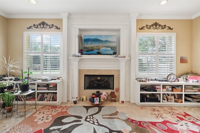 6686 SE 135th St, Summerfield, FL 34491 - sitting room featuring crown molding, healthy amount of natural light, a fireplace with flush hearth, tile patterned flooring, and recessed lighting