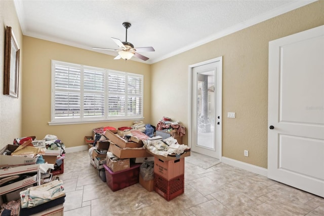 6686 SE 135th St, Summerfield, FL 34491 - dining room featuring crown molding, ceiling fan, a textured ceiling, light tile patterned floors, and a textured wall