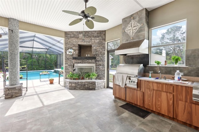 6686 SE 135th St, Summerfield, FL 34491 - view of patio / terrace with an outdoor kitchen, grilling area, a sink, a ceiling fan, and an outdoor pool