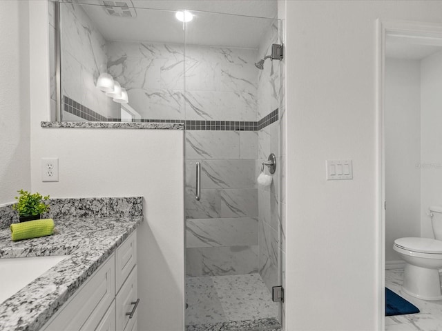 full bath featuring a stall shower, marble look tiles, toilet, and vanity
