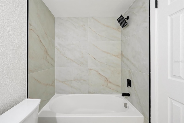 full bath featuring bathing tub / shower combination and toilet