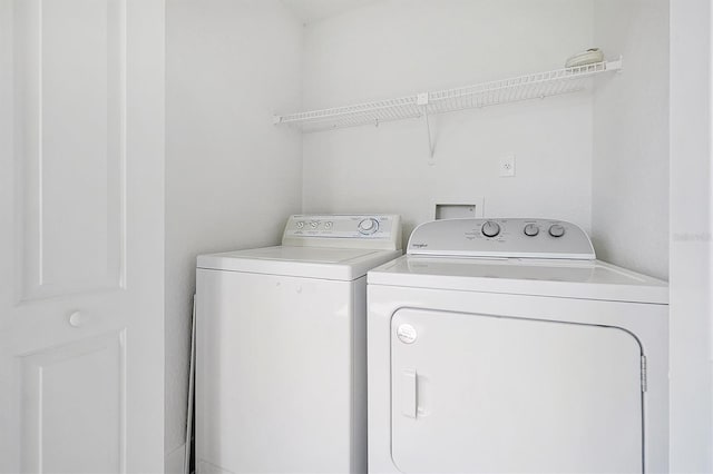 washroom featuring washer and dryer