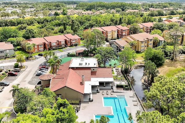 aerial view of residential area with a pool