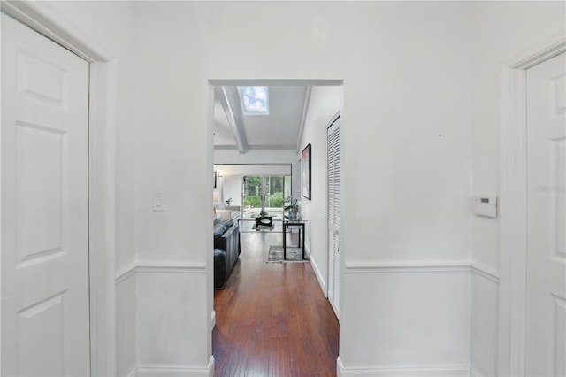 628 Riverpark Cir, Longwood, FL 32779 - corridor with dark wood-style flooring and beamed ceiling