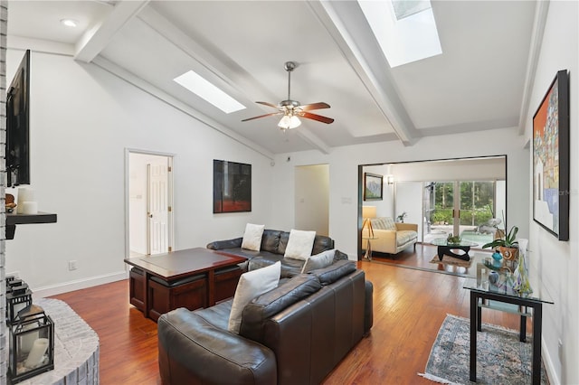 628 Riverpark Cir, Longwood, FL 32779 - living room with a skylight, dark wood finished floors, a ceiling fan, and baseboards