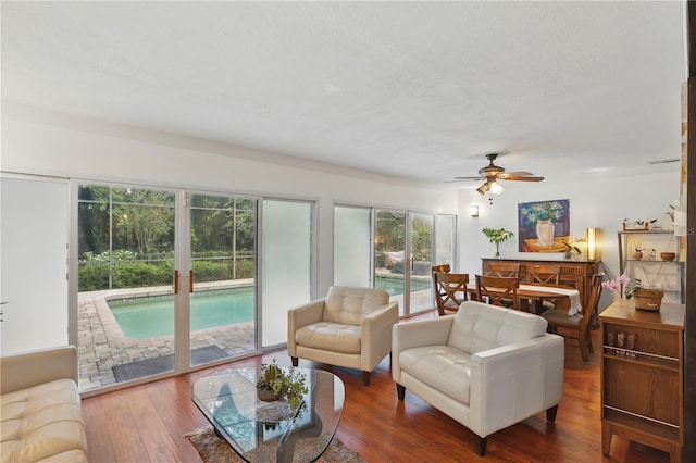 628 Riverpark Cir, Longwood, FL 32779 - living area with ceiling fan and wood finished floors