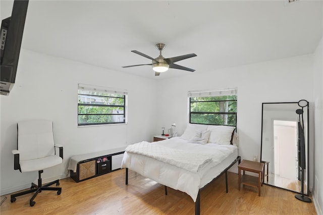 628 Riverpark Cir, Longwood, FL 32779 - bedroom featuring multiple windows, light wood-style floors, and ceiling fan