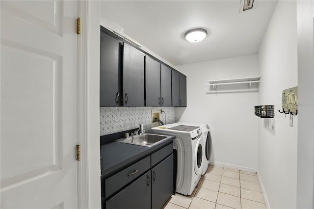 628 Riverpark Cir, Longwood, FL 32779 - laundry room with cabinet space, separate washer and dryer, light tile patterned floors, and baseboards