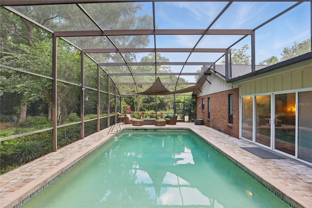 628 Riverpark Cir, Longwood, FL 32779 - swimming pool featuring an outdoor hangout area, a patio, and glass enclosure