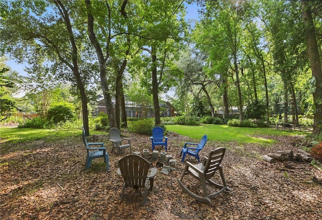 628 Riverpark Cir, Longwood, FL 32779 - view of grassy yard with a fire pit