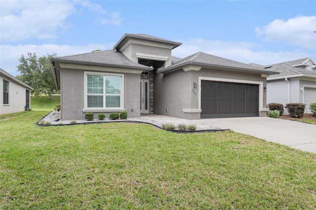 1602 W Caroline Path, Lecanto, FL 34461 - view of front of property featuring a garage, concrete driveway, stucco siding, and a front yard