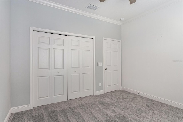 1602 W Caroline Path, Lecanto, FL 34461 - unfurnished bedroom featuring carpet flooring, crown molding, baseboards, a closet, and ceiling fan