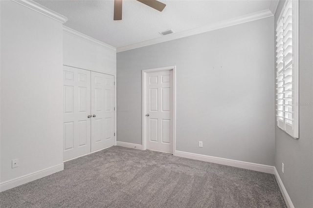 1602 W Caroline Path, Lecanto, FL 34461 - unfurnished bedroom featuring crown molding, carpet flooring, a closet, and baseboards