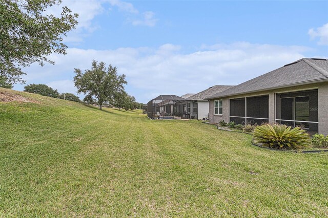 1602 W Caroline Path, Lecanto, FL 34461 - view of grassy yard featuring glass enclosure