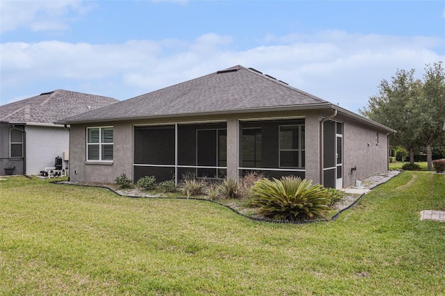 1602 W Caroline Path, Lecanto, FL 34461 - back of property with stucco siding, a yard, roof with shingles, and a sunroom