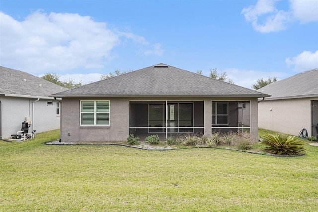 1602 W Caroline Path, Lecanto, FL 34461 - back of property featuring a yard, a shingled roof, stucco siding, and a sunroom
