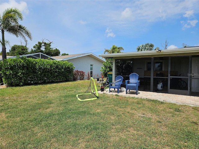 119 Caddy Rd, Rotonda West, FL 33947 - view of grassy yard featuring a patio area