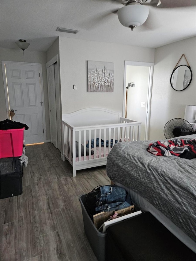 119 Caddy Rd, Rotonda West, FL 33947 - bedroom with wood finished floors and a ceiling fan
