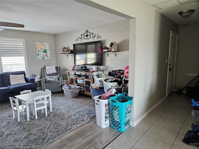 119 Caddy Rd, Rotonda West, FL 33947 - living area featuring ceiling fan, wood finished floors, and baseboards