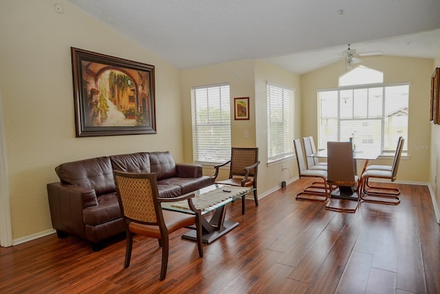 2208 Antigua Pl Unit 932, Kissimmee, FL 34741 - living area with lofted ceiling, dark wood-style floors, ceiling fan, healthy amount of natural light, and baseboards