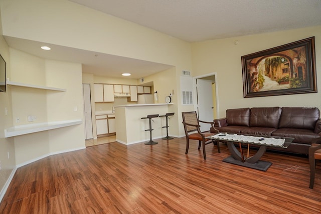 2208 Antigua Pl Unit 932, Kissimmee, FL 34741 - living room with wood finished floors, baseboards, and recessed lighting