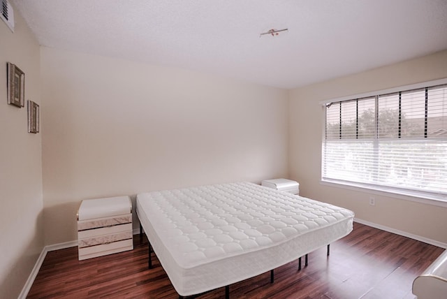 2208 Antigua Pl Unit 932, Kissimmee, FL 34741 - bedroom featuring baseboards and wood finished floors