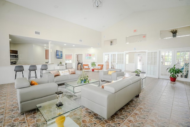 2208 Antigua Pl Unit 932, Kissimmee, FL 34741 - living room with french doors and high vaulted ceiling