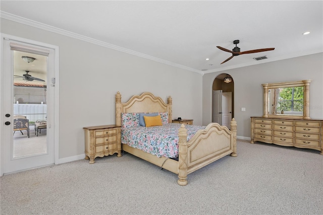 bedroom with crown molding, baseboards, arched walkways, carpet floors, and recessed lighting