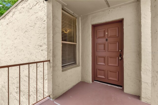 514 Orange Dr Unit 31, Altamonte Springs, FL 32701 - view of exterior entry featuring stucco siding
