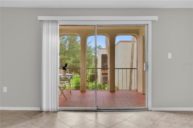 514 Orange Dr Unit 31, Altamonte Springs, FL 32701 - doorway to outside with tile patterned flooring and baseboards