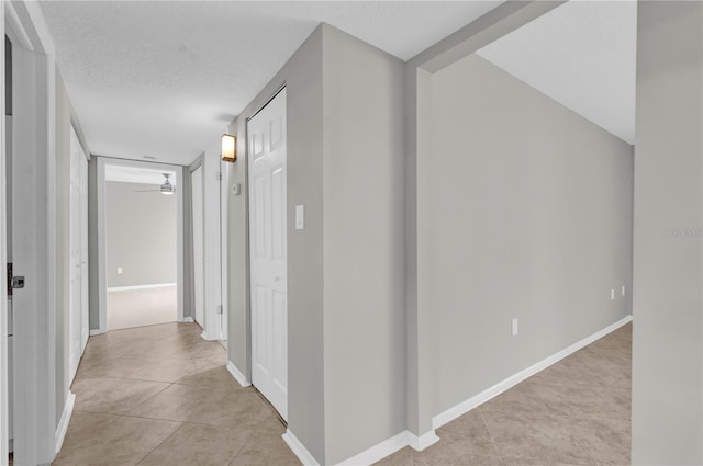 514 Orange Dr Unit 31, Altamonte Springs, FL 32701 - corridor featuring baseboards and light tile patterned flooring