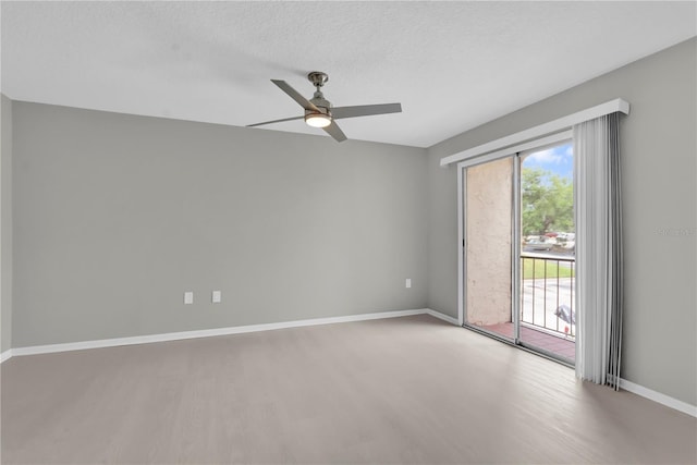 514 Orange Dr Unit 31, Altamonte Springs, FL 32701 - unfurnished room featuring wood finished floors, baseboards, ceiling fan, and a textured ceiling