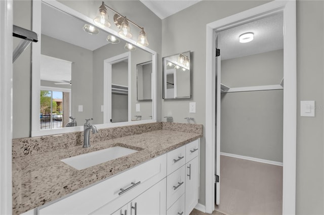 514 Orange Dr Unit 31, Altamonte Springs, FL 32701 - bathroom with vanity and a walk in closet