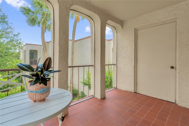 514 Orange Dr Unit 31, Altamonte Springs, FL 32701 - sunroom / solarium featuring a textured wall, plenty of natural light, and tile patterned floors