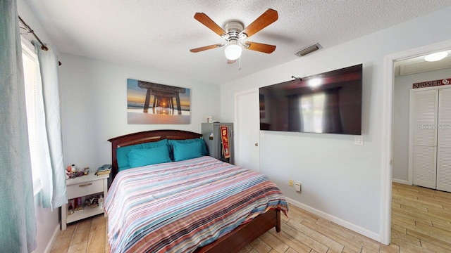 12381 Antonio Cir, Orlando, FL 32826 - bedroom featuring wood finished floors, baseboards, and a ceiling fan