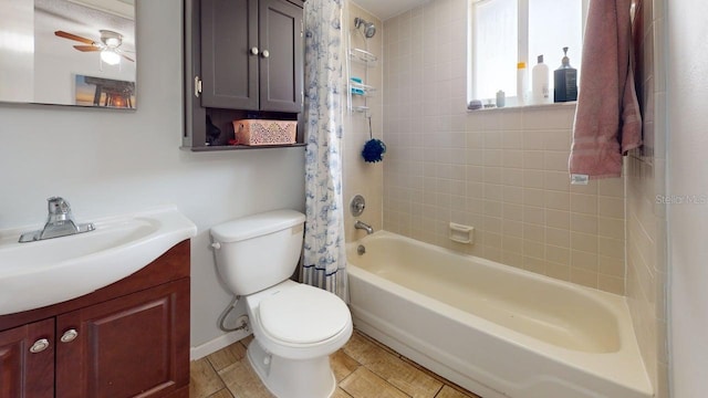 12381 Antonio Cir, Orlando, FL 32826 - full bath with toilet, vanity, a ceiling fan, shower / bath combo, and baseboards