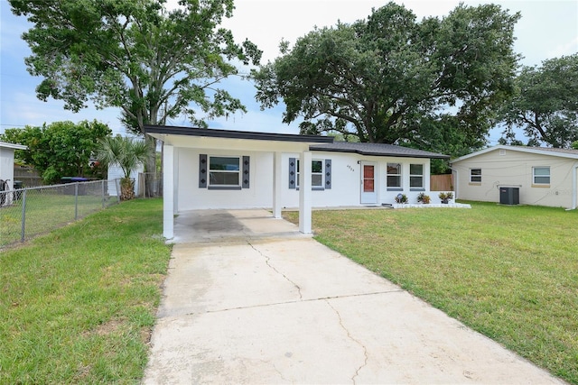 4824 Shoshone St, Orlando, FL 32819 - ranch-style house with driveway, central AC, a carport, and stucco siding