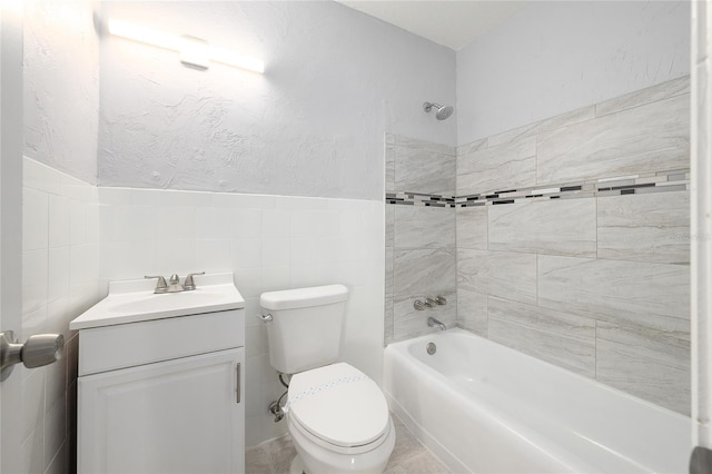 4824 Shoshone St, Orlando, FL 32819 - full bath featuring vanity, washtub / shower combination, tile walls, and toilet