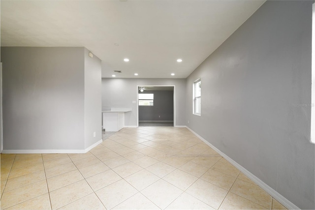 4824 Shoshone St, Orlando, FL 32819 - empty room featuring light tile patterned floors, recessed lighting, and baseboards
