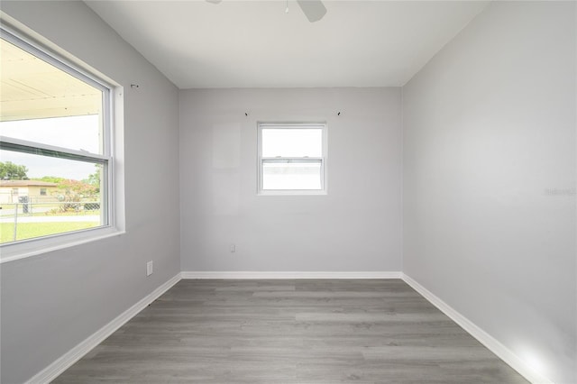 4824 Shoshone St, Orlando, FL 32819 - unfurnished room with ceiling fan, wood finished floors, and baseboards