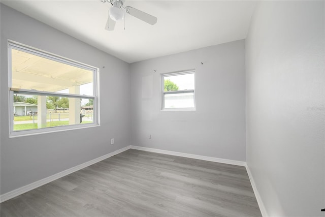 4824 Shoshone St, Orlando, FL 32819 - unfurnished room featuring wood finished floors, baseboards, and a ceiling fan