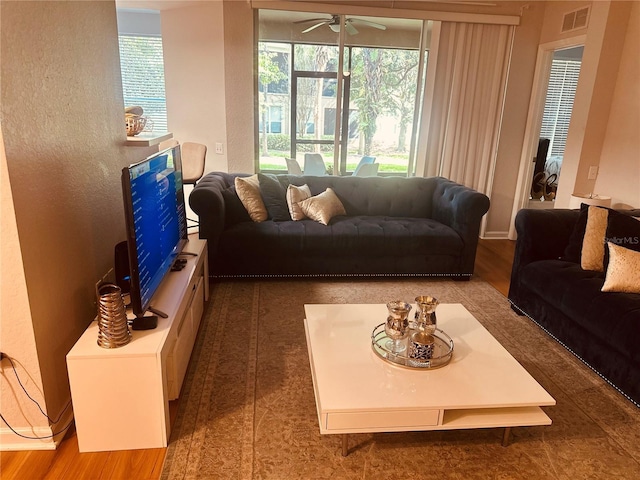 6450 Alcalde Ct Unit 106, Orlando, FL 32835 - living area with a ceiling fan and wood finished floors