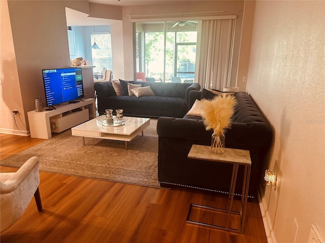 6450 Alcalde Ct Unit 106, Orlando, FL 32835 - living room with wood finished floors and ceiling fan