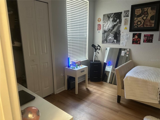 6450 Alcalde Ct Unit 106, Orlando, FL 32835 - bedroom featuring wood finished floors
