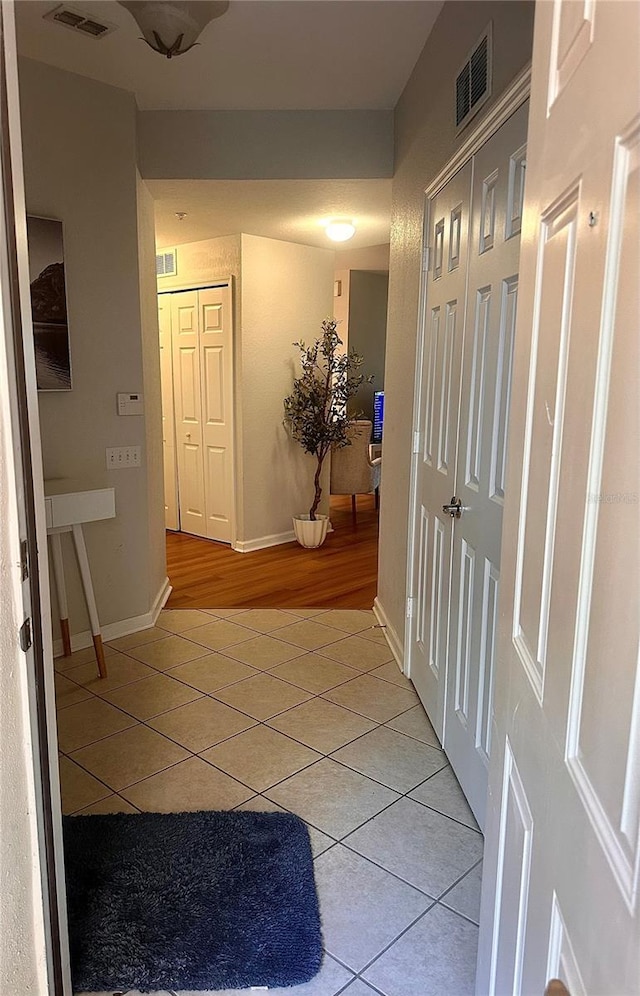6450 Alcalde Ct Unit 106, Orlando, FL 32835 - hall with light tile patterned floors