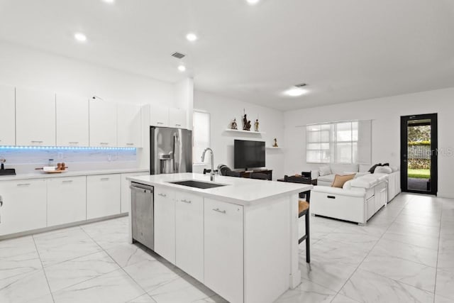 4445 SW 173rd Ave, Miramar, FL 33029 - kitchen with a sink, appliances with stainless steel finishes, light marble finish floors, light countertops, and recessed lighting