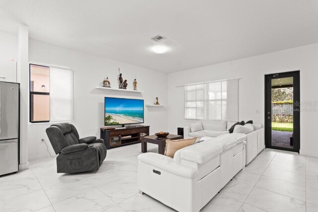 4445 SW 173rd Ave, Miramar, FL 33029 - living room featuring light marble finish flooring