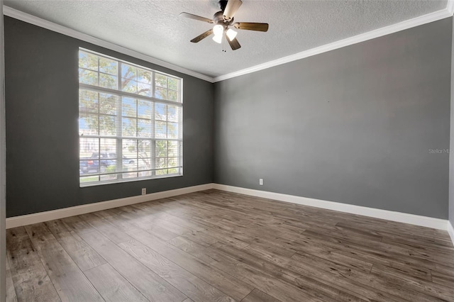 12411 Scarlett Sage Ct, Winter Garden, FL 34787 - spare room featuring a textured ceiling, wood finished floors, a ceiling fan, crown molding, and baseboards