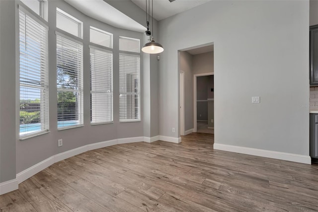 12411 Scarlett Sage Ct, Winter Garden, FL 34787 - unfurnished dining area with wood finished floors and baseboards