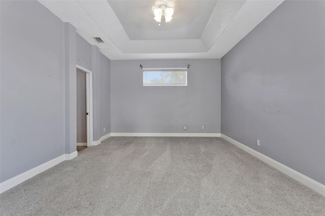 12411 Scarlett Sage Ct, Winter Garden, FL 34787 - carpeted spare room with a raised ceiling and baseboards